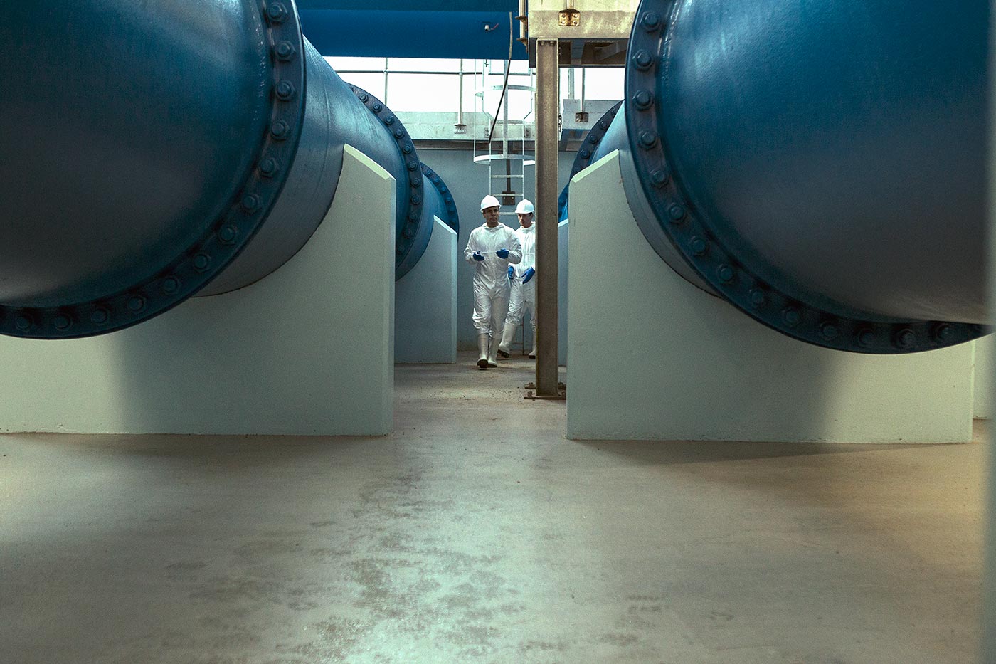 Technicians in white lab coats