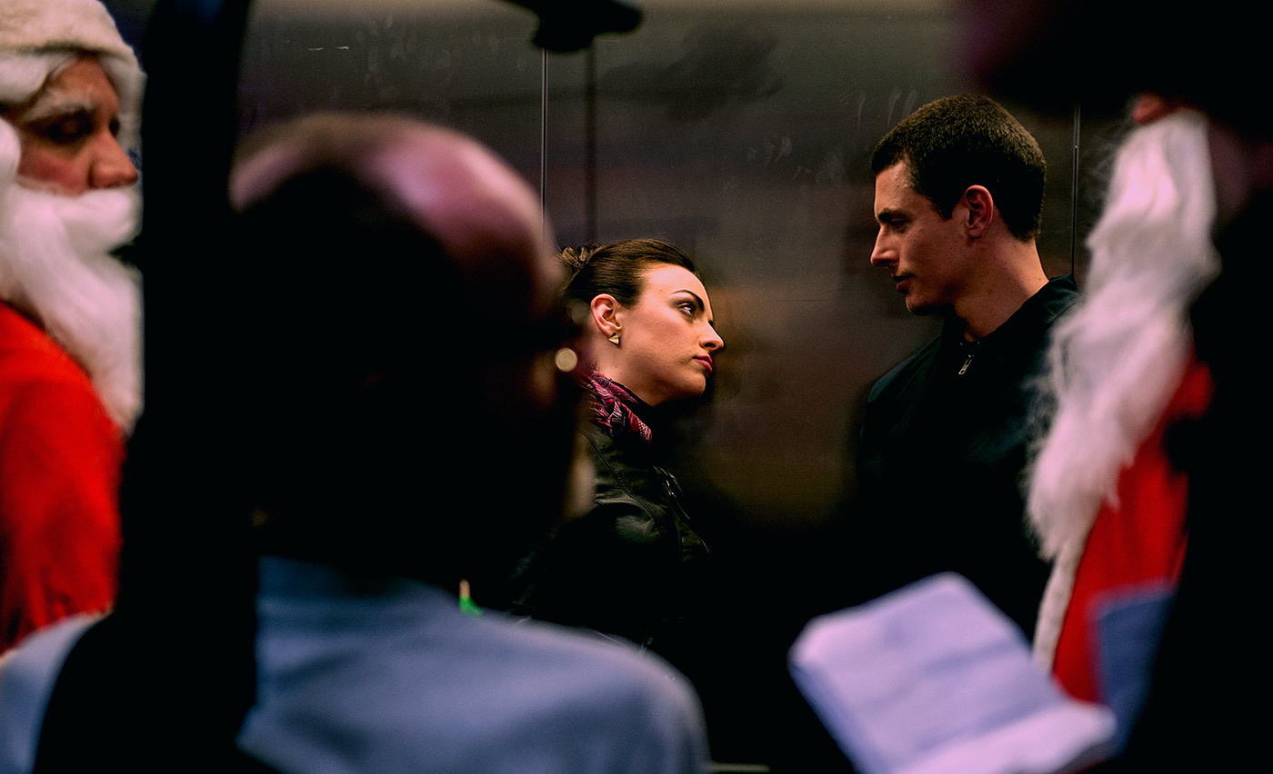 Lachlan and Nora-Jane in the lift with Santas